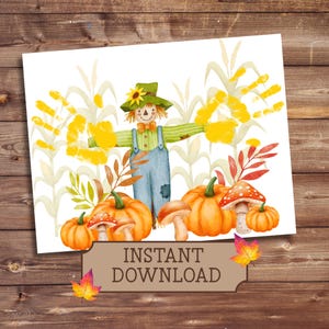 May include: Watercolor illustration featuring a scarecrow with handprint arms, pumpkins, and mushrooms. The scarecrow wears a green hat and overalls. The image includes the text "INSTANT DOWNLOAD" on a banner.
