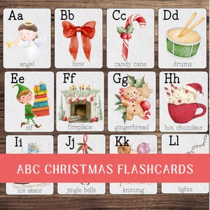 May include: Set of ABC Christmas flashcards featuring watercolor illustrations. Each card displays a letter and a corresponding Christmas-themed image, such as an angel, bow, candy cane, drums, elf, fireplace, gingerbread, and hot chocolate.