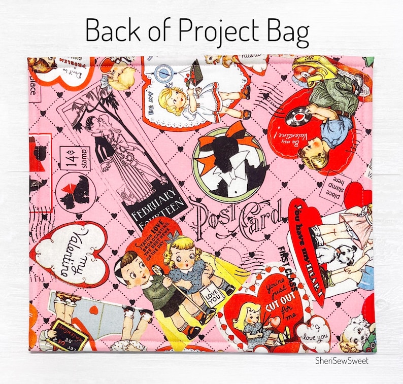 May include: Pink fabric with a repeating pattern of vintage Valentine's Day cards and images. The fabric features hearts, red and white stripes, and the text "Valentine", "Post Card", "February Fourteen", and "You're just cut out for me".
