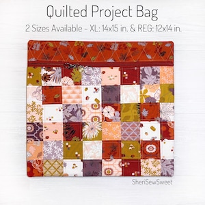 May include: A quilted project bag with a patchwork design in shades of red, orange, brown, green, and white. The bag has a zipper closure and is available in two sizes: XL (14x15 inches) and REG (12x14 inches).