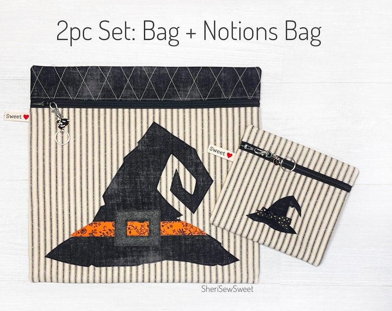 May include: A 2-piece set of Halloween-themed zippered bags. The larger bag features a black witch hat with an orange and black striped band. The smaller bag features a smaller black witch hat. Both bags are made of a white fabric with black stripes.