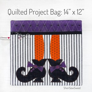 May include: A quilted project bag with a witch's legs and shoes design. The bag is 14 inches by 12 inches and has a black and white striped fabric with orange and black polka dots. The bag has a purple zipper and a purple and black spiderweb design on the top flap.