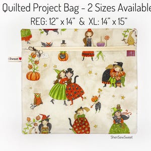 May include: Quilted project bag with a cream background and a Halloween-themed pattern. The bag features a zipper closure and a small charm. The regular size is 12" x 14" and the XL size is 14" x 15". The text "Quilted Project Bag - 2 Sizes Available" is at the top.