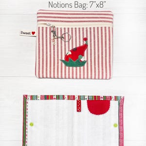 May include: Two red and white striped fabric bags with a Christmas elf design. The smaller bag is 7 inches by 8 inches and the larger bag is 10.5 inches by 6 inches. The text "Notions Bag: 7"x8"" and "Buddy: 10.5"x6" opened" is printed below the bags.