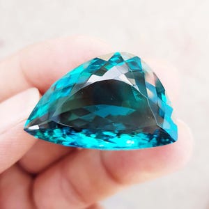 Lab Grown Dark Green Topaz: Hydro Fancy Shield Cut, 46 Carat Gemstone