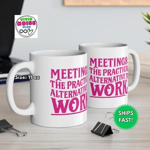 White ceramic mug with the phrase “Meetings: The Practical Alternative To Work” in bold pink text, styled on a black marble countertop in a luxury condo. Perfect gift for co-worker, colleague, boss - friend mum dad girlfriend boyfriend husband wife partner or special person in your life.