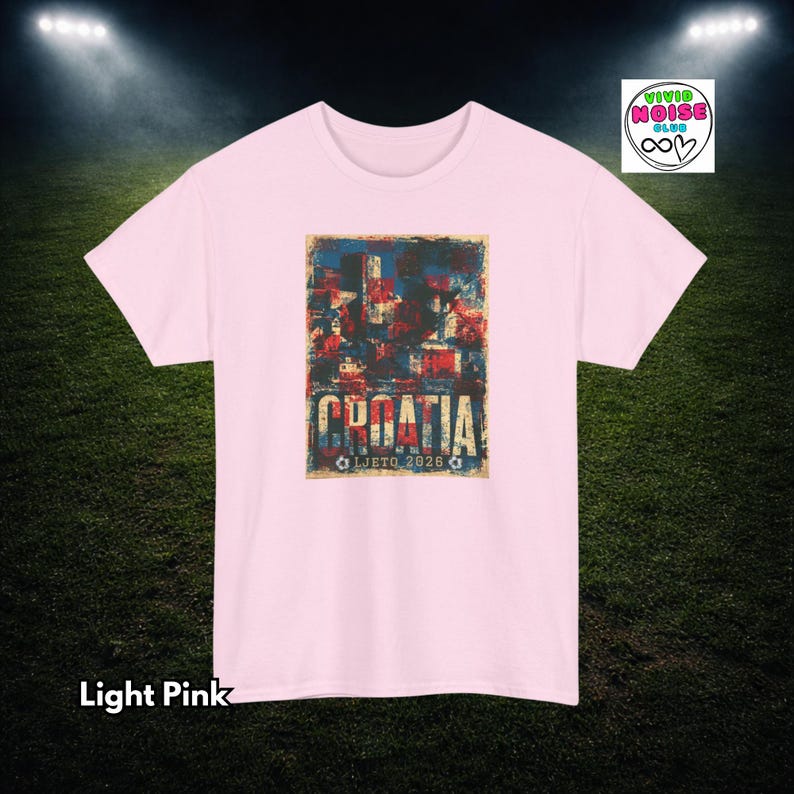 Light pink Croatia football tee with faded red white and blue colours, distressed retro football lettering and summer 2026 tournament energy.