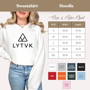 May include: A white sweatshirt with the text "LYTVK" and a triangle design. The image also includes a size and color chart, with measurements in inches and color options like red, orange, and black.