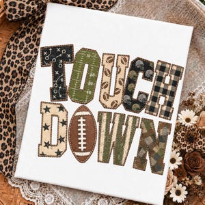 May include: A white canvas featuring the word TOUCHDOWN in large, block-style letters. Each letter has a unique pattern, including football play diagrams, a green field grid, footballs, helmets, black stars, and plaid or camouflage prints.