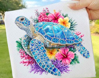 May include: A square canvas print featuring a detailed illustration of a blue sea turtle with a jeweled shell. The turtle is surrounded by vibrant pink, yellow, and purple flowers and coral against a white background.