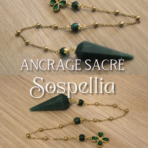 May include: A gold-colored chain with green gemstone accents and a dark green, cone-shaped pendant. The chain features a four-leaf clover design and the text "ANCRAGE SACRÉ" and "Sospellia".