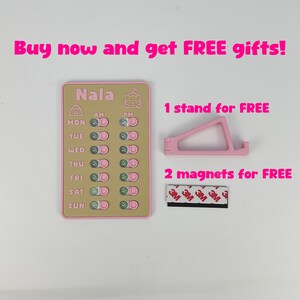 May include: A pink and tan weekly chore chart with the name "Nala" at the top, along with a pink phone stand and two magnets. The text "Buy now and get FREE gifts!" is at the top.