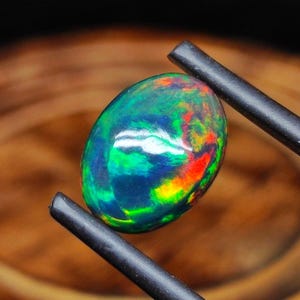 12x10mm Ethiopian Black Opal Cabochon: Multi-Fire Gemstone