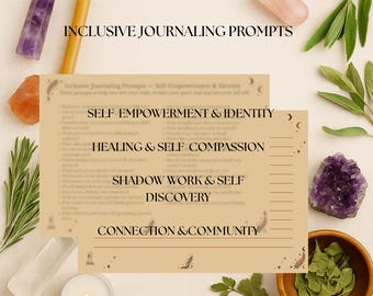 May include: Two beige journaling prompt cards with the text "INCLUSIVE JOURNALING PROMPTS" and prompts for self-empowerment, healing, shadow work, and connection. The cards are surrounded by crystals, herbs, and a candle.
