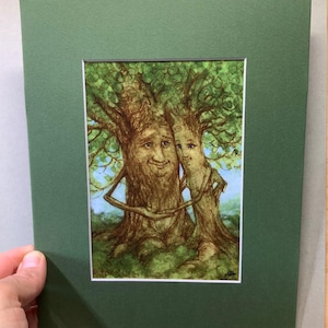 May include: A set of three ceramic mugs with a speckled, matte finish. The mugs are in shades of cream, light gray, and dark gray. Each mug has a simple, minimalist design, perfect for coffee or tea.