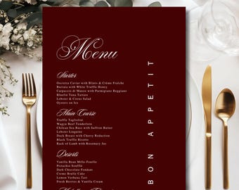 May include: A deep burgundy rectangular menu card featuring white text with the headings Menu, Starter, Main Course, Deserts, and Bon Appetit. The list includes items like Oscietra Caviar, Wagyu Beef Tenderloin, and Vanilla Bean Mille-Feuille.
