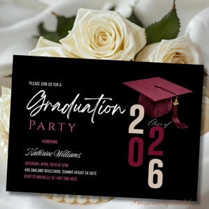May include: A black graduation party invitation with white and burgundy text. The invitation includes the words "Graduation Party" and "Class of 2026". A burgundy graduation cap is featured on the right side of the invitation. White roses are in the background.