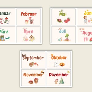 May include: A collection of illustrated cards displaying the months of the year in German. Each card features a month's name alongside seasonal illustrations, including a snowman for January and a pumpkin for October. The cards are arranged in a grid.