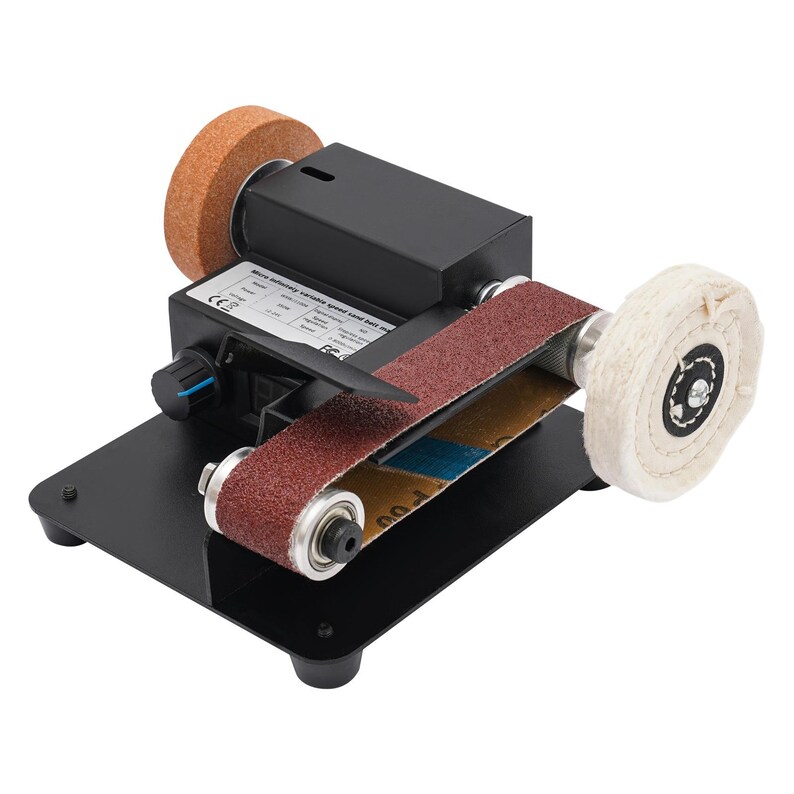 a sanding machine with a sanding wheel and a sanding belt. The sanding machine has a black base and a red sanding belt.