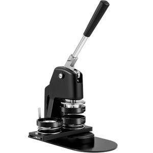 May include: A black button maker machine with a silver handle and base. The machine has a lever for pressing and two circular molds. The machine is designed for creating custom buttons and badges.