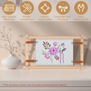 May include: A wooden embroidery hoop with a floral design. The hoop has a light brown frame with brown leather straps. The embroidered fabric features purple, pink, and white flowers. Text on the image says "High Quality Materials" and "Simple Installation."