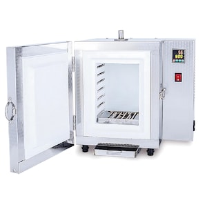 May include: A stainless steel electric kiln with the door open, revealing a white interior and a metal shelf. The digital display shows temperature readings. The kiln is designed for heating materials to high temperatures.