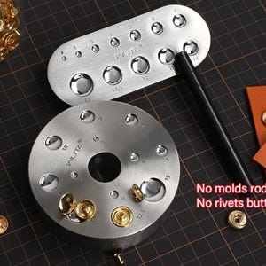 May include: A set of metal tools for crafting, including a round and an oval-shaped piece with various sized indentations. The tools are labeled with numbers and the brand name "WLITA". A black rod and gold-colored rivets are also present. The text "No molds rod No rivets buttons" is visible.