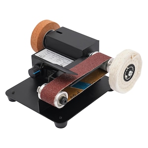 a sanding machine with a sanding wheel and a sanding belt. The sanding machine has a black base and a red sanding belt.