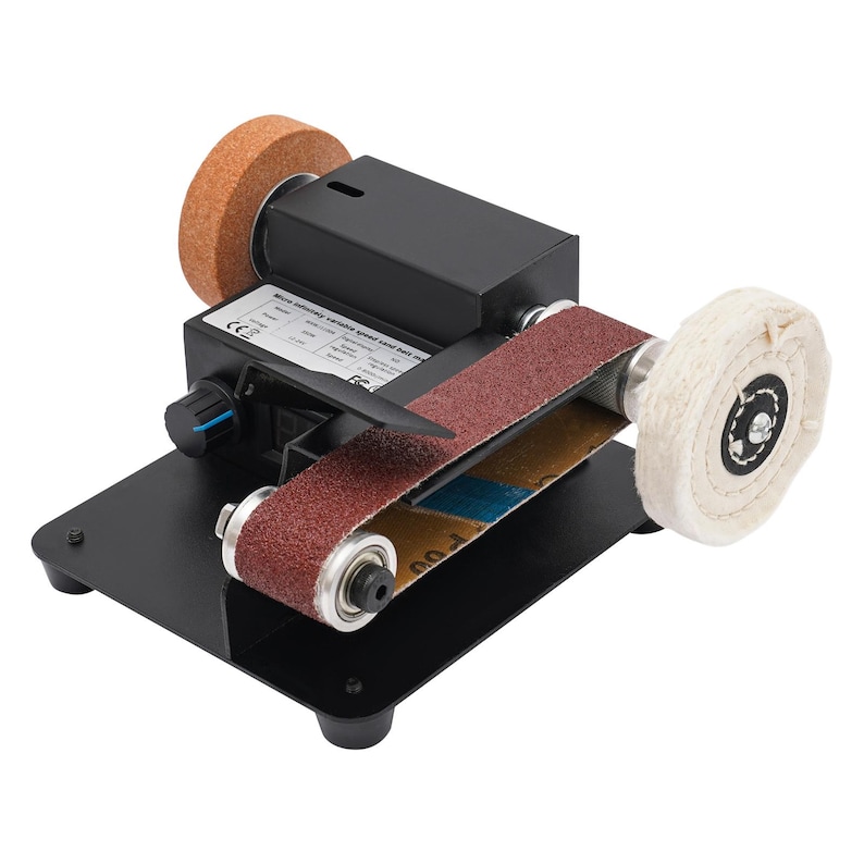 a sanding machine with a sanding wheel and a sanding belt. The sanding machine has a black base and a red sanding belt.