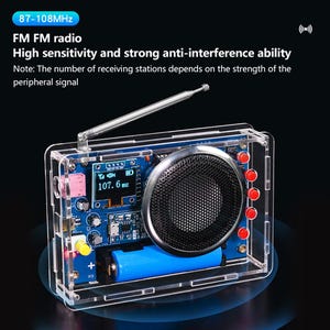 May include: Clear acrylic FM radio with a blue circuit board interior. The radio has a black speaker, a digital display showing 107.6 MHz, and a silver antenna. The text on the radio reads "87-108MHz" and "FM FM radio".