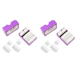 May include: A collection of knitting tools, including purple boxes, white combs, and purple trays filled with white knitting needles. The boxes have a label with text. The tools are arranged on a white background.