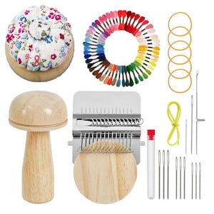 May include: A craft kit with a floral pin cushion, a rainbow of embroidery floss, needles, a wooden mushroom-shaped tool, a weaving tool, rubber bands, and a needle threader. The kit is designed for various sewing and crafting projects.