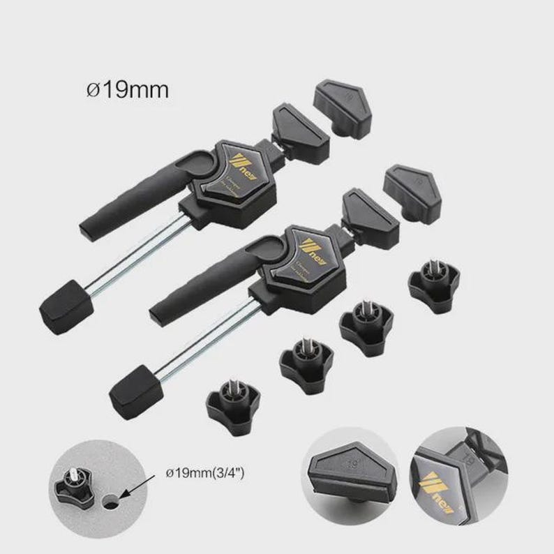 a set of black and gold clamping tools, including a clamp with a 19mm (3.4") handle and a set of hexagonal tools.