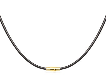 May include: A black leather necklace with a gold-colored magnetic clasp. The necklace is displayed against a white background, highlighting the contrast between the dark cord and the bright clasp.