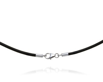 May include: A black leather necklace with a silver clasp. The necklace is a simple, elegant design, perfect for everyday wear. The clasp is a lobster claw style, and the necklace appears to be approximately 16 inches long.