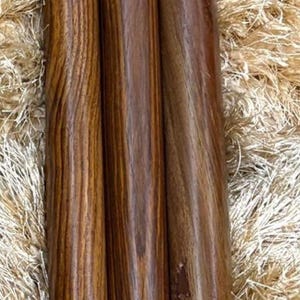 May include: Three wooden furniture legs with a rich, dark brown grain. The legs have brass-colored accents at the base and top, and are designed for furniture. The legs are approximately 12 inches tall.