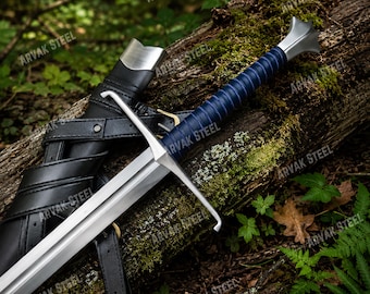 May include: A steel sword with a dark blue leather-wrapped grip, a silver crossguard, and a matching silver pommel. The sword is accompanied by a black leather scabbard featuring silver metal accents and integrated black leather straps.