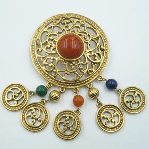 Large 80s charm brooch, matte gold finish