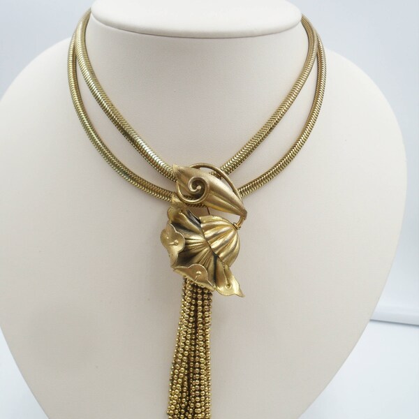 Thirties era brass flower brooch with cascading chain stamens
