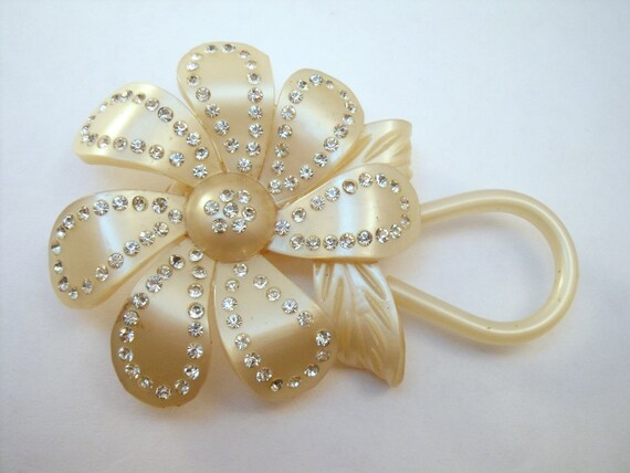 Luminous celluloid rhinestone studded flower brooc