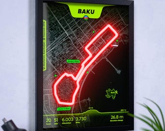 Könnte beinhalten: Ein gerahmtes Wandbild mit einer Karte des Baku City Circuit in Aserbaidschan. Die Strecke ist in leuchtendem Rot auf einer dunkelgrauen Stadtkarte dargestellt. Der Text enthält Baku, 20 Kurven, 51 Runden, 6,003 Kilometer und 3,730 Meilen.