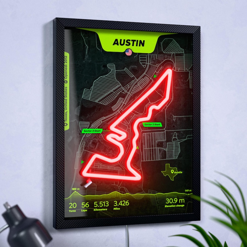 Modern Austin F1 track wall art featuring a glowing red LED neon circuit inside a black frame. The detailed map of Circuit of the Americas includes track statistics, an elevation profile, and the Austin, Texas location, creating a unique Formula 1-inspired home or office decor piece for racing fans.