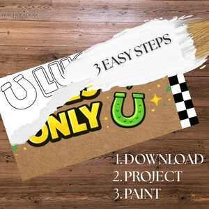 May include: A craft project with the words "U ONLY" in yellow and green, a green horseshoe, and the text "3 EASY STEPS". The steps are "1. DOWNLOAD 2. PROJECT 3. PAINT". The background is a wooden surface.