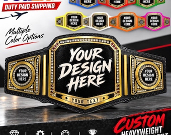 May include: A black championship belt with gold accents and a central plate featuring the text "YOUR DESIGN HERE" and "YOUR TEXT". The belt includes side plates and decorative stones. Multiple smaller versions in blue, red, green, yellow, white, orange, and pink are shown above.