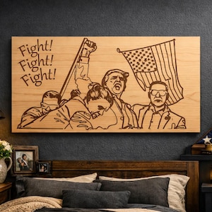 May include: Wooden wall art featuring an engraved illustration of a group of people with an American flag. The words "Fight! Fight! Fight!" are above the figures. The artwork is displayed above a bed.