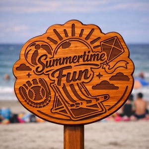 May include: Wooden sign with the words "Summertime Fun" and beach-themed illustrations. The sign features a baseball, kite, beach chair, sun, and clouds, all carved into the wood. The sign is mounted on a wooden post.