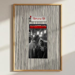 May include: Framed art print featuring a black and white photograph of a couple, set within a lighter-shaped design. The top of the design reads "Light of my Life" in red script. The background has a black and white striped pattern.