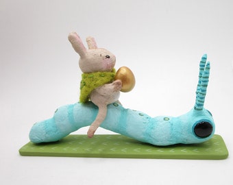 Cotton Spun Easter caterpillar with bunny rider and gold painted egg