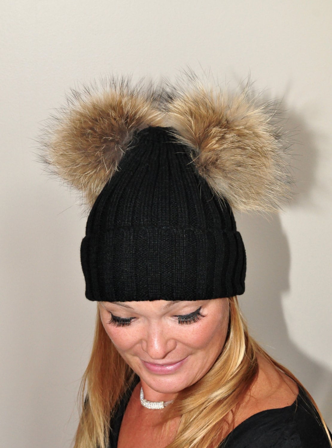 black bobble hat with brown bobble