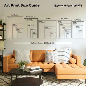 May include: An art print size guide with dimensions in inches and centimeters. The guide includes ratios such as 3:4, A Size (A1-4), 1:1, 4:5, and 5:7. A tan sofa, 96 inches (243.8cm) wide, is in the foreground.